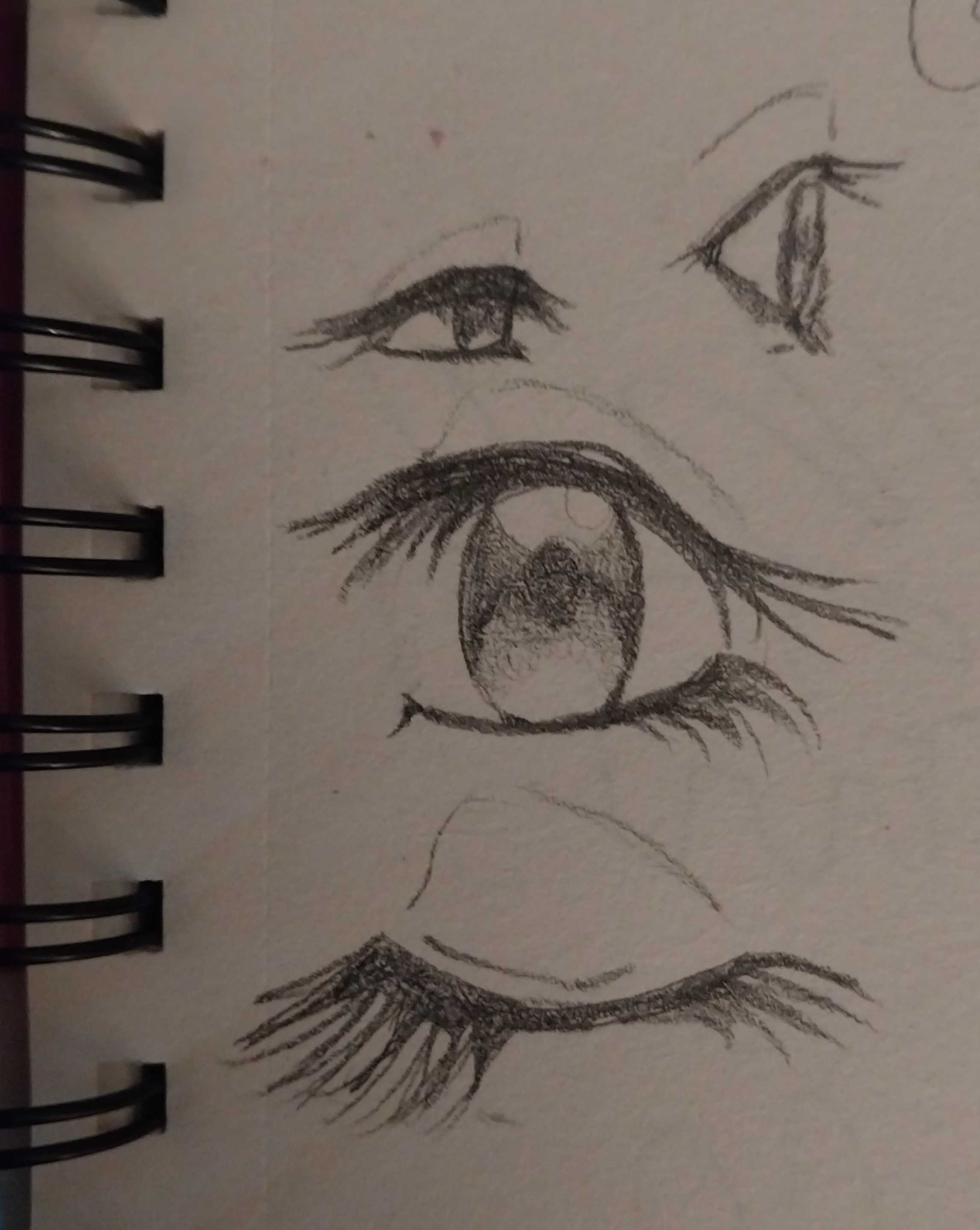 Sketches of anime eyes in various sizes